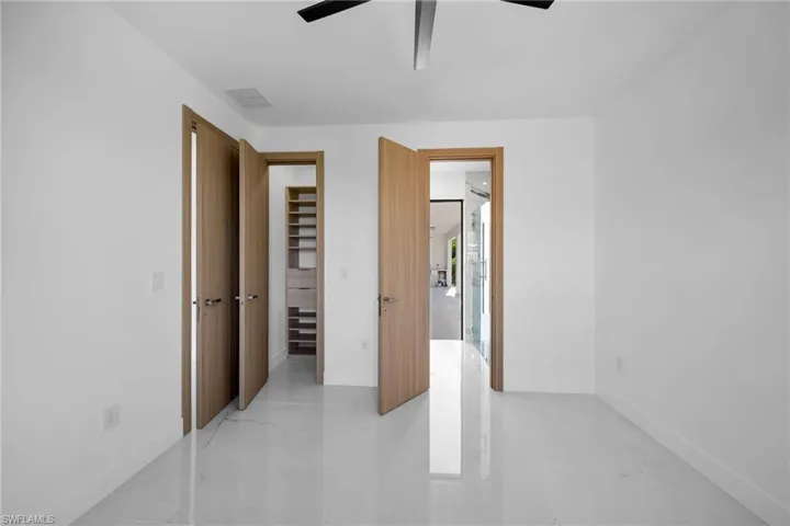 Unfurnished bedroom featuring a closet and ceiling fan