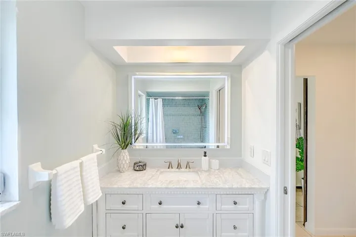 Bathroom featuring vanity and a shower with curtain