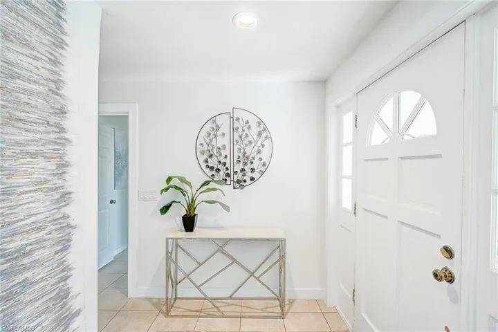Entryway featuring light tile patterned floors