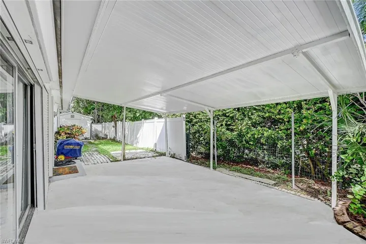 View of patio featuring a shed