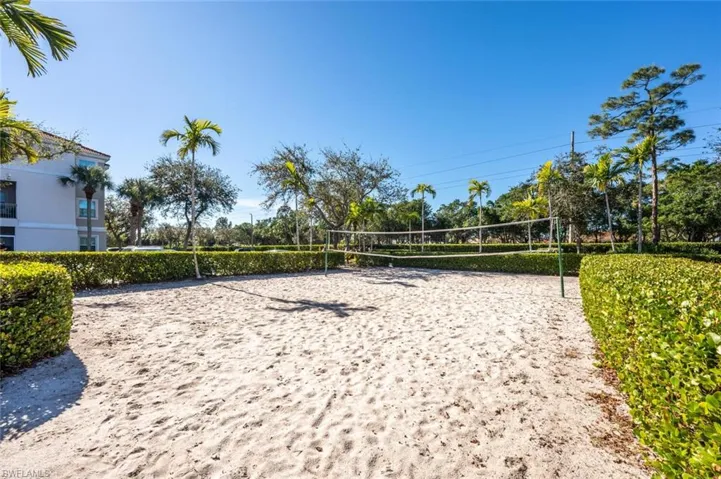 View of home's community featuring volleyball court