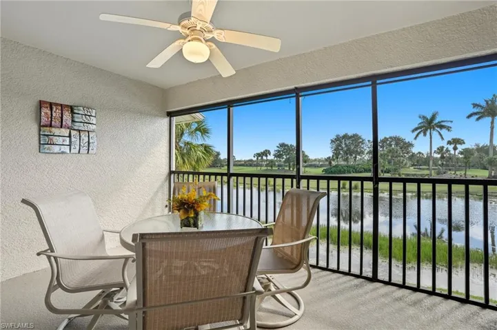 Sunroom with a water view