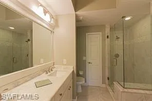 Dual vanity with light-toned countertops and undermount sinks