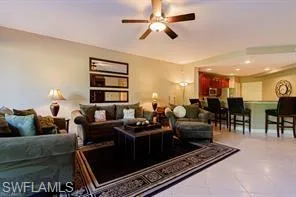 Recessed lighting, ceiling fan, and tiled flooring