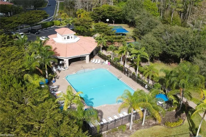 Community pool with a patio