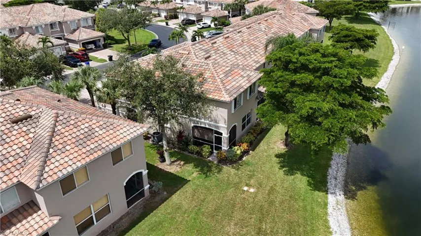 Aerial perspective of suburban area with a large body of water