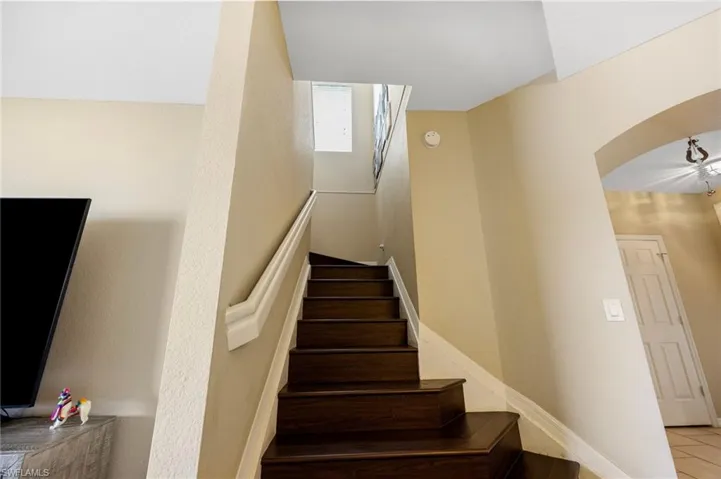 Stairs featuring arched walkways