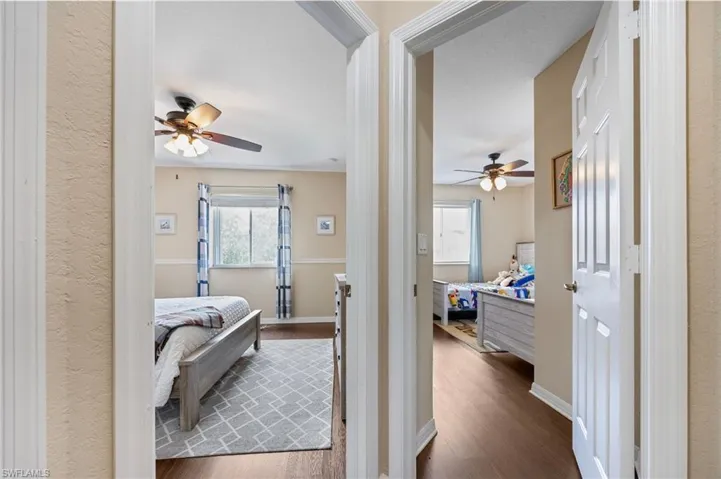 Bedroom with dark wood-style floors
