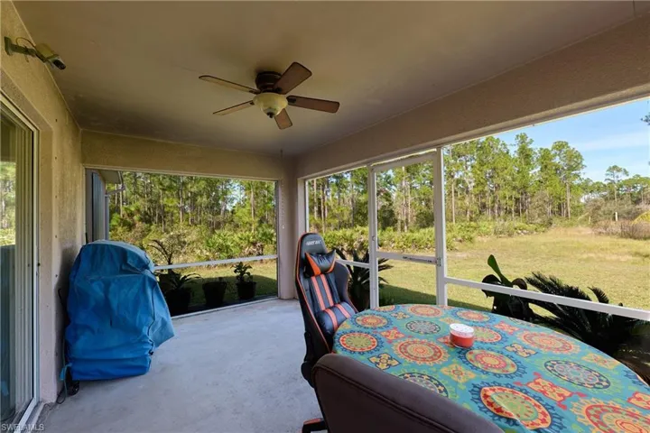 Sunroom with ceiling fan and healthy amount of natural light