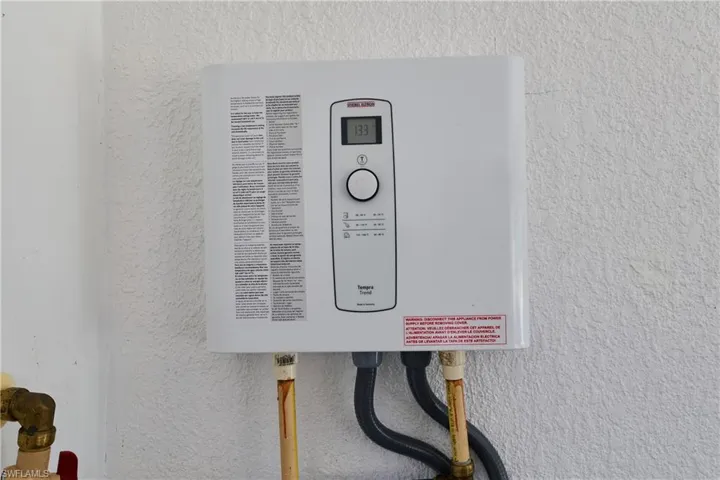 Detailed view of a textured wall and tankless water heater