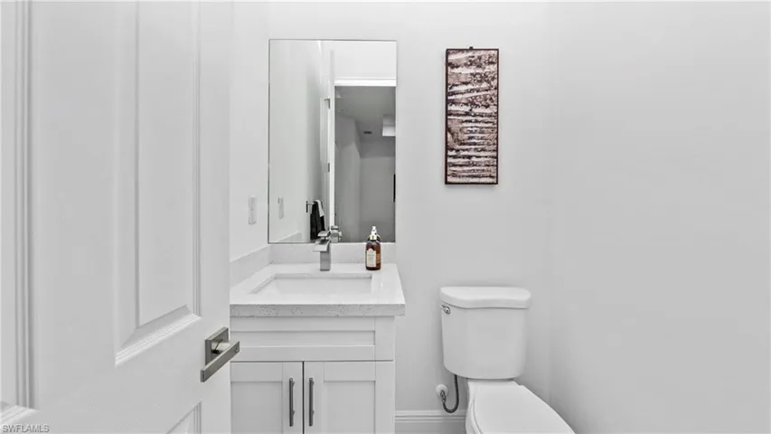 Bathroom featuring vanity and toilet