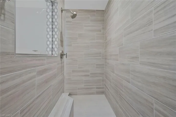 Full bathroom with a tile shower