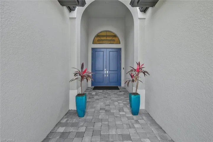 Property entrance with stucco siding