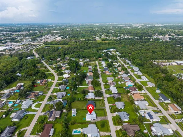Aerial perspective showcasing a residential neighborhood with numerous single-story homes