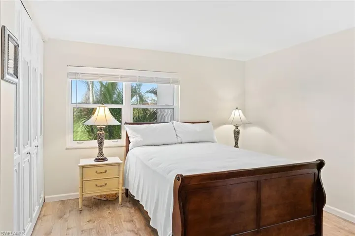 Master Bedroom with vinyl flooring and wall closets