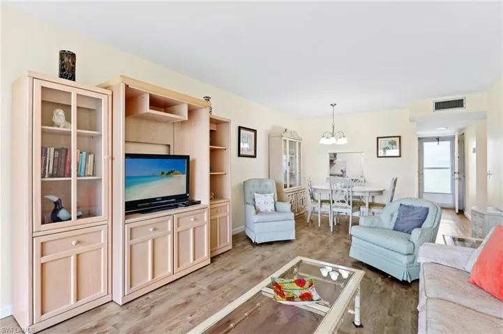 Living room with a chandelier and vinyl  flooring
