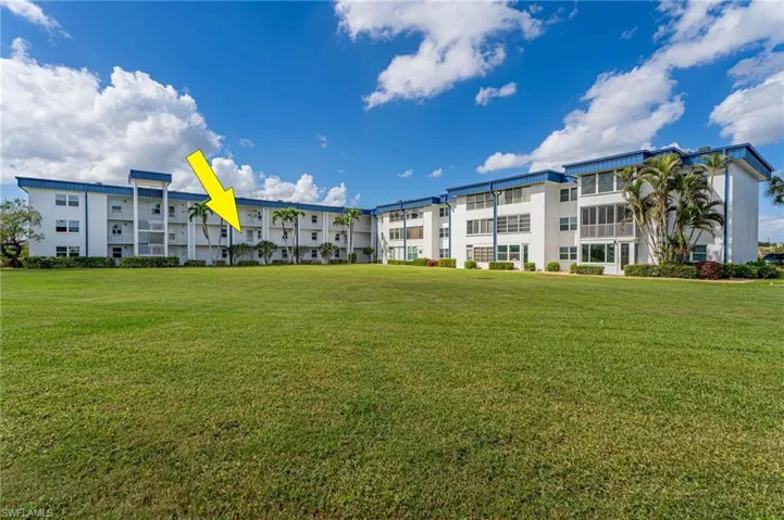 View of property's community featuring a yard
