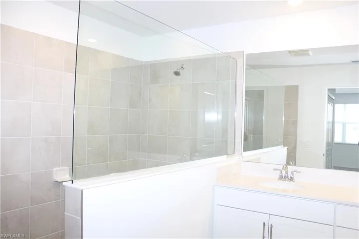 Master Bathroom featuring a walk in shower and vanity