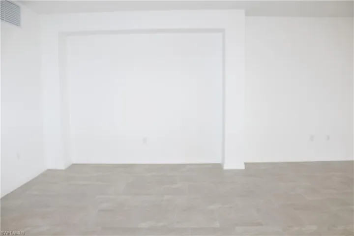 Unfurnished room with visible vents