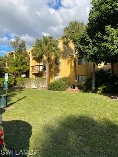 View of green lawn with a balcony