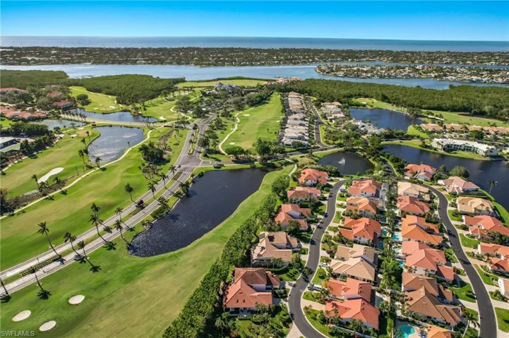 Birds eye view of property with a water view
