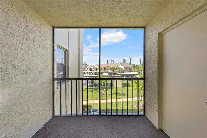 Balcony with a sunroom and a residential view
