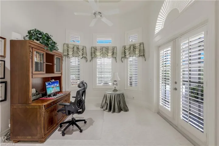 The primary bedroom features a cozy den/office space. Enjoy direct access to the pool and spa.