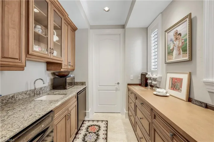 There is even a small kitchenette in the cabana. Your guests will love the privacy this area offers! Behind the door is a very large air conditioned storage area.