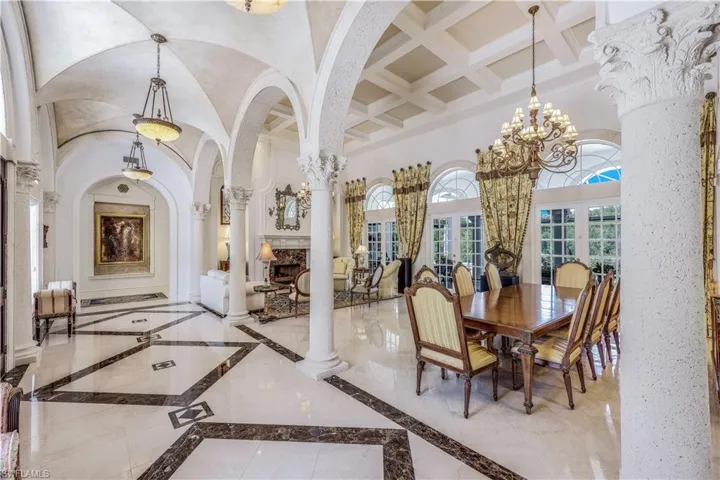 Enter through the foyer into the formal living and dining area.