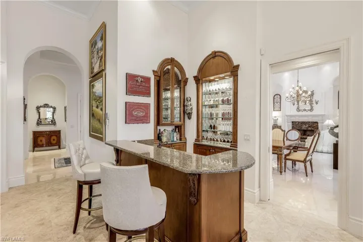 The bar is open to the kitchen, living area and informal dining.