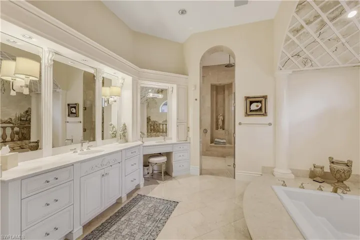 Primary bathroom with separate prep space for both of you, a HUGE walk-in shower, & a soaking tub.