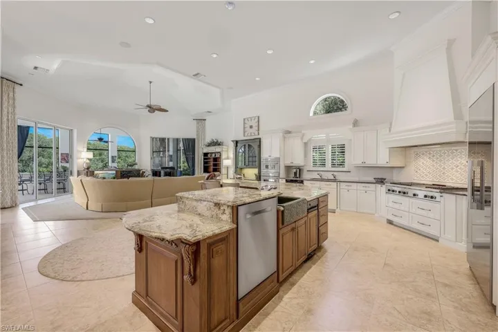 Great room with updated kitchen and many windows/doors overlooking the pool.lanai area.