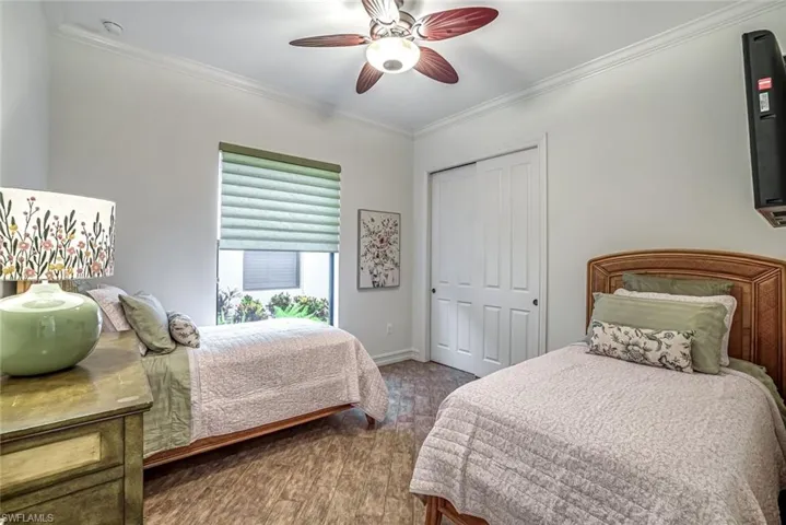 Second guest bedroom with custom closet storage