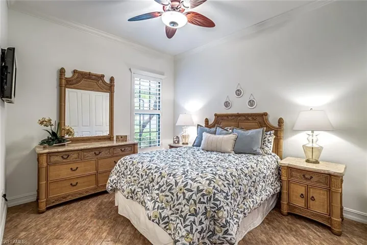 Elegantly appointed guest bedroom with custom closet storage