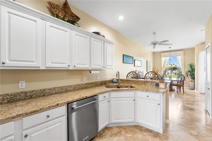 White cabinetry, granite countertops. Great views of the golf course from the kitchen as well!
