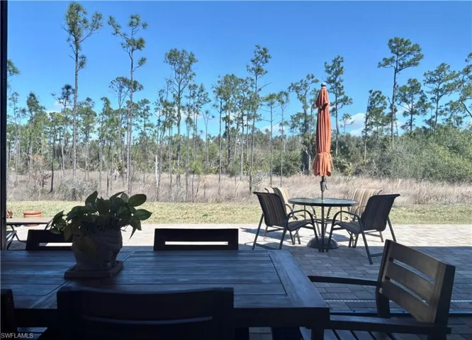 Expansive outdoor living area featuring a paver patio