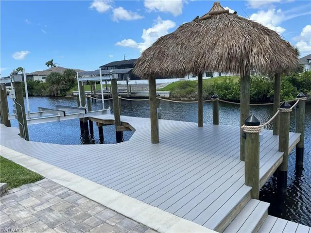 Dock area featuring a water view