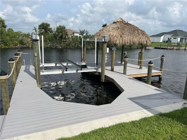View of dock with a water view