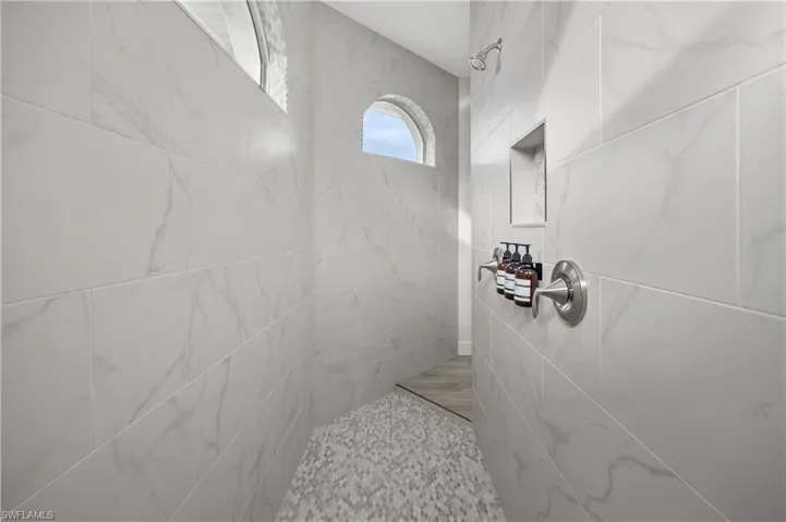 Bathroom with a tile shower