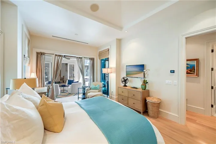 Bedroom featuring light wood finished floors, recessed lighting, and access to outside