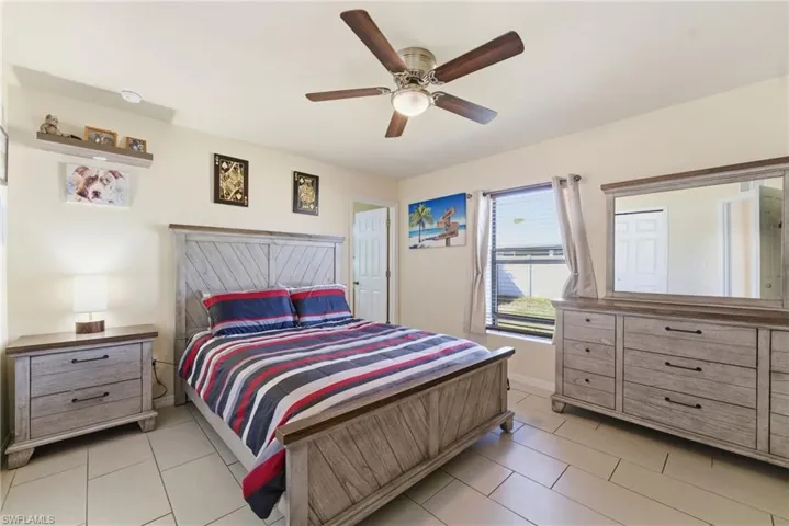 Bedroom featuring ceiling fan and light tile patterned floors