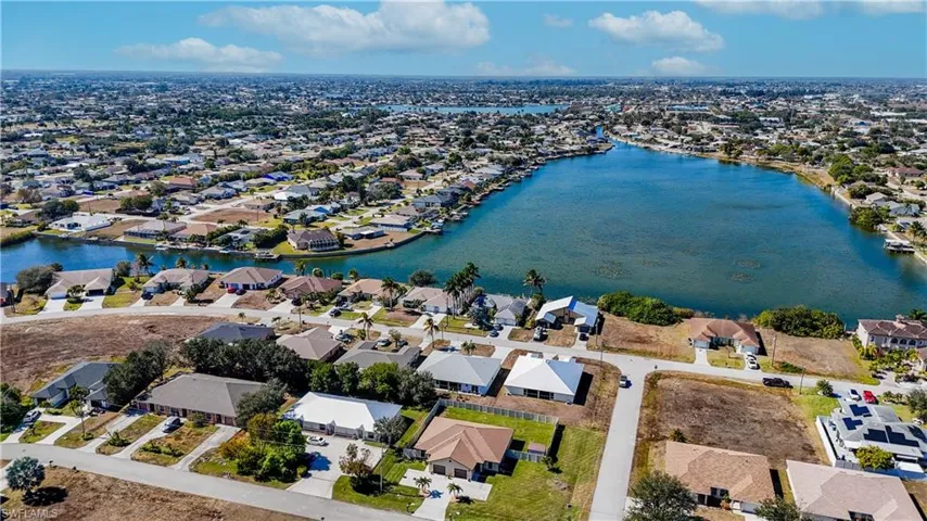 View of property location featuring nearby suburban area and a nearby body of water