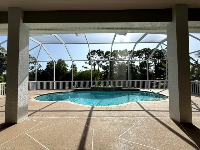 Outdoor pool featuring a patio and a lanai