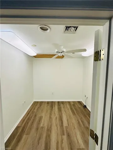 Empty room featuring hardwood / wood-style floors