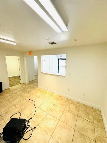 Empty room with light tile patterned floors