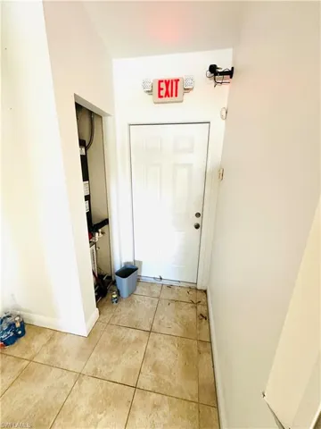 Doorway to outside featuring light tile patterned floors