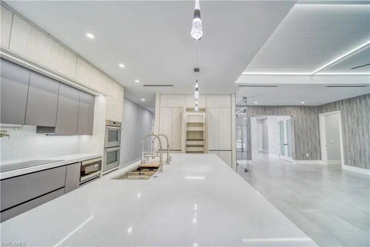 Kitchen with modern cabinets, a huge sink, recessed lighting, and Thermador stainless steel appliances