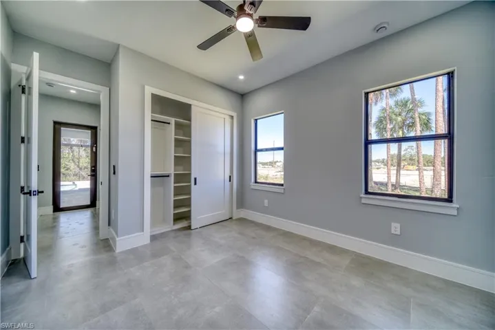 Bedroom #4 featuring a closet, recessed lighting, a ceiling fan