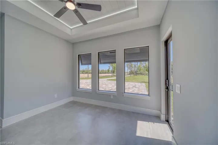 Office/Den, a raised ceiling, a ceiling fan