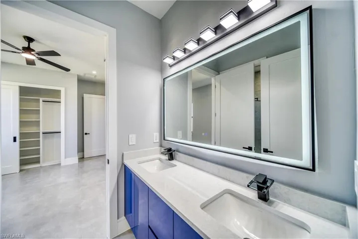 Bath #3 featuring double vanity and dual sinks